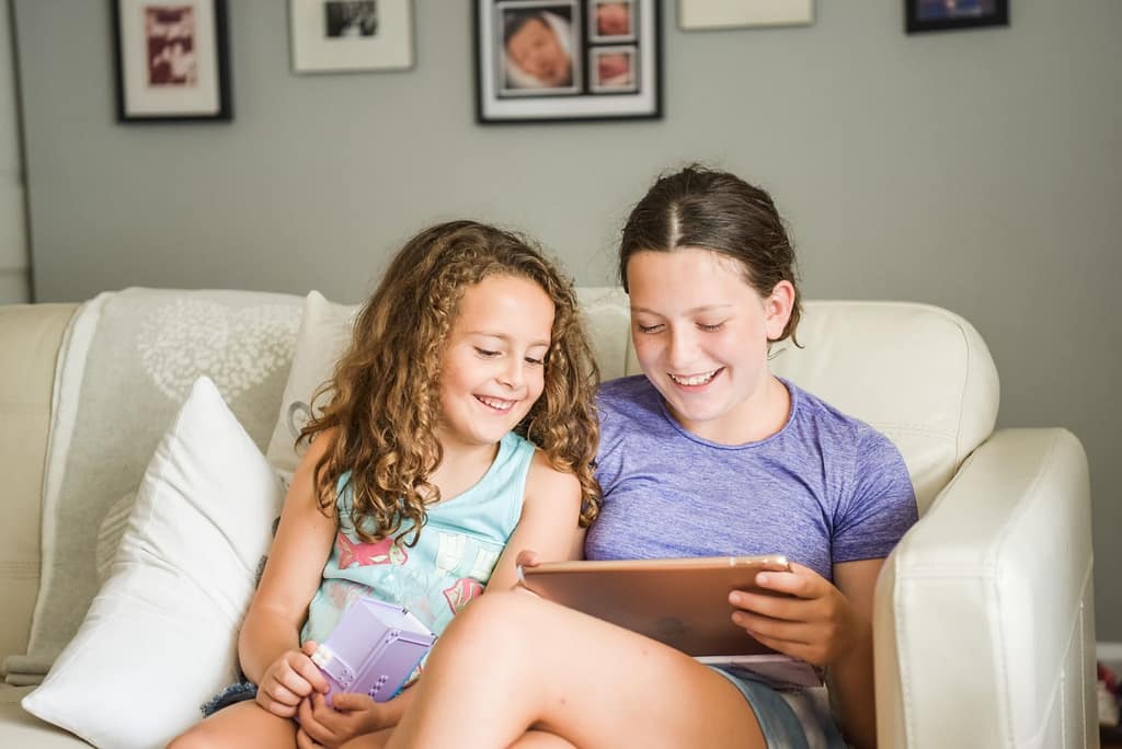 Two kids watching a video on an iPad together