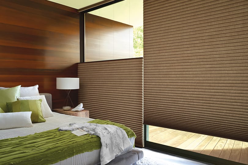 Hunter Douglas Alustra® Duette® Honeycomb Shades installed in a bedroom