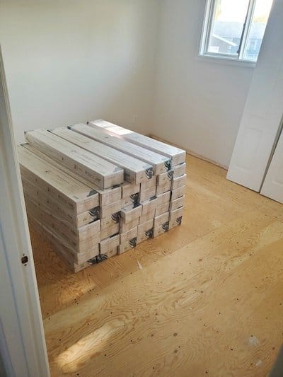 Stack of new laminate floor ready for installation