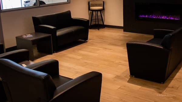 Wood-look tile installated in car dealership lounge