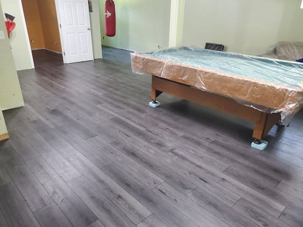 Grey laminate floor in games room